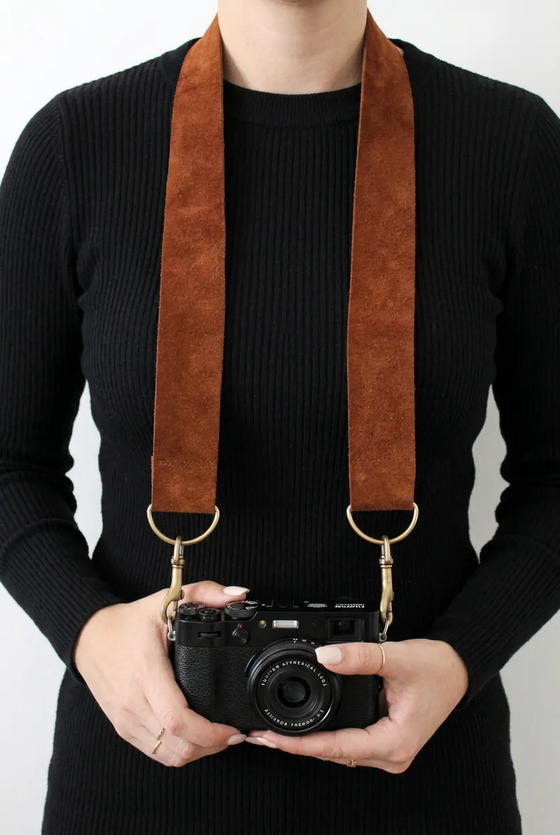 A hand-cut leather camera strap
